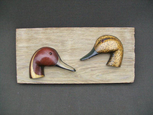 Carved Pintail Heads on Wood