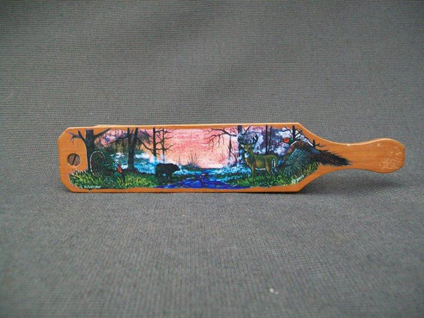 Turkey call - decorative with carvings on side and scenery on top