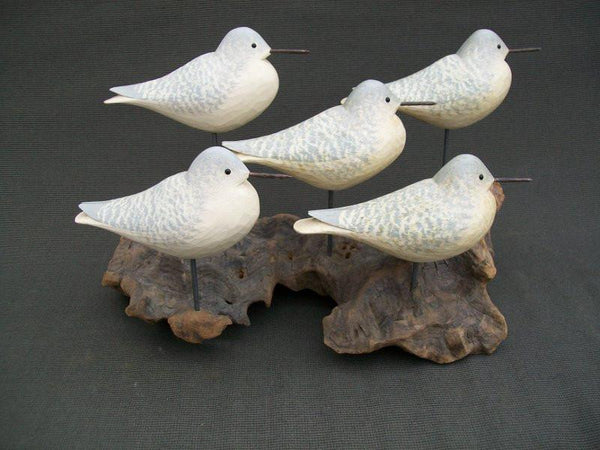 Five Peeps raised wings on driftwood stand