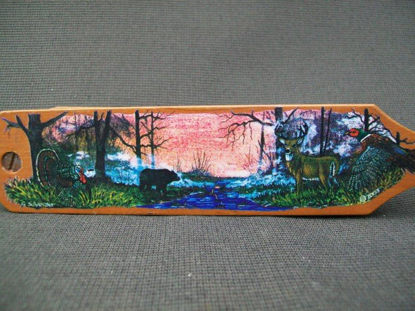 Turkey call - decorative with carvings on side and scenery on top