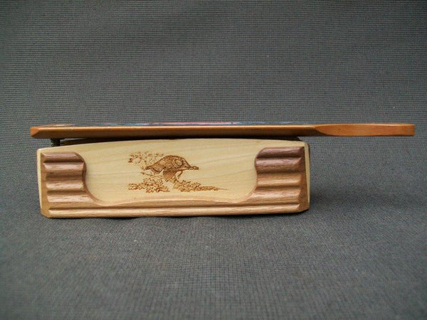 Turkey call - decorative with carvings on side and scenery on top
