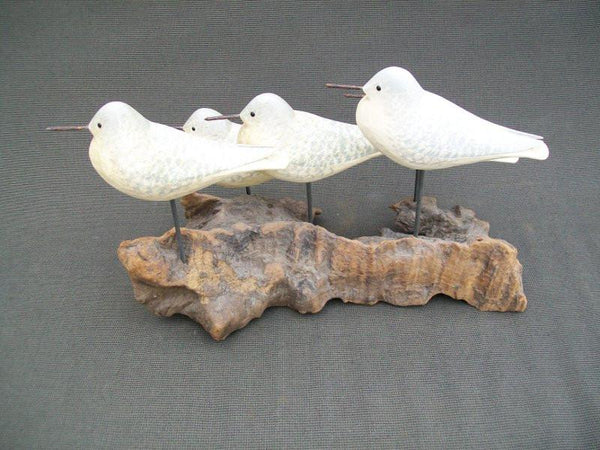 Five Peeps raised wings on driftwood stand
