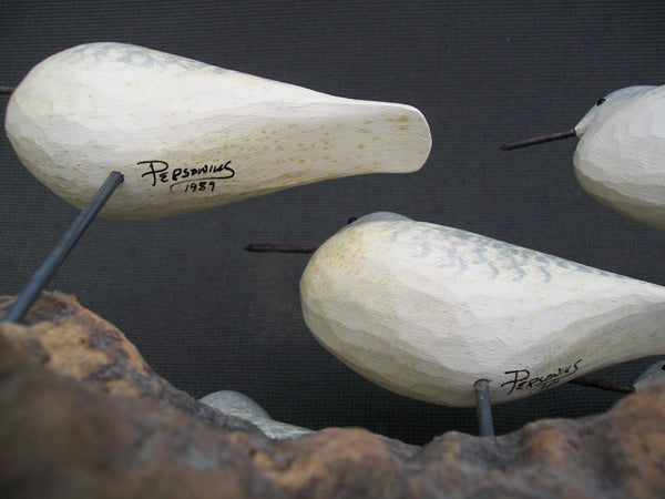 Five Peeps raised wings on driftwood stand